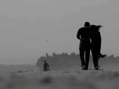 A couple walking arm in arm understanding love