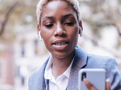 Through innovative technology and community-based agents, a woman taps into a network that extends banking services to the unbanked, redefining financial accessibility