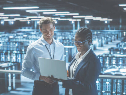 An IT expert utilizes a tablet to track data flows in a cloud computing facility, optimizing server operations related to quantum information theory and multidimensional scaling