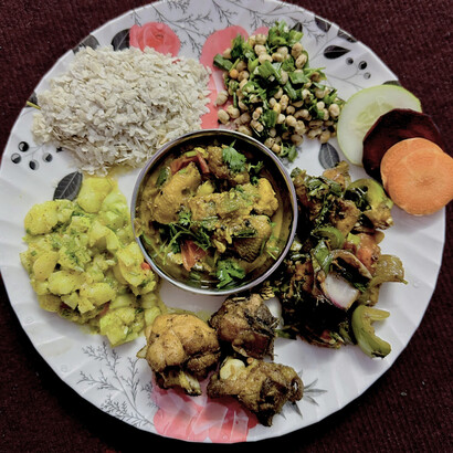 Newari food, a traditional cuisine popular among the Newar community of the Kathmandu Valley — featuring a variety of dishes such as spiced chicken, pickles, and seasonal vegetables