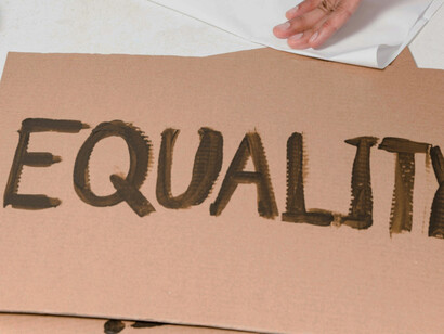 A sign made of cardboard, which reads ''Equality''