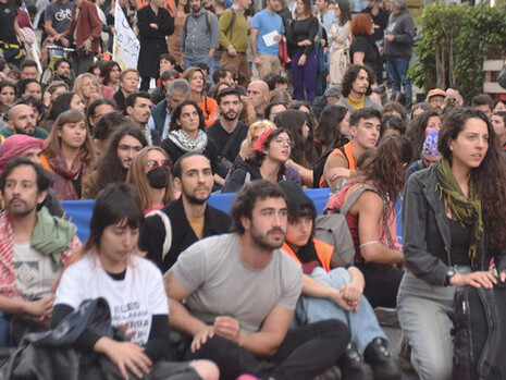 Peaceful protesters gather on a city street, symbolising the growing global demand for economic justice and the need for systemic change in light of rising inequality and climate crisis