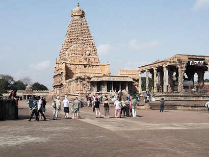 Visitors to Brihadeeswarar Temple can explore its stunning courtyard, detailed frescoes, and the awe-inspiring 66-meter tall central dome, making it a must-visit destination for those interested in history, art, and architecture, Thanjavur, India
