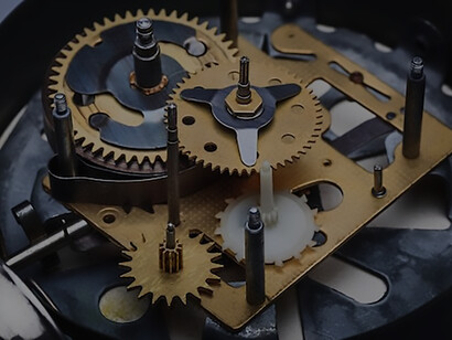 A close-up exploration of the intricate details within a clock's mechanism, revealing the captivating world of gears, springs, and precision that orchestrates the measurement of time