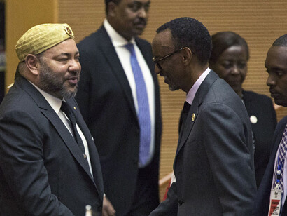 King of Morocco Mohammed VI greets Rwanda's President Paul Kagame