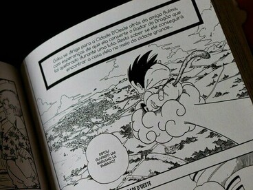 An open Japanese manga volume featuring Goku, representing the evolution of manga through the combination of artistic traditions, influences, and storytelling forms
