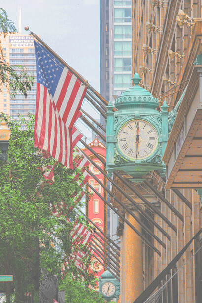 Marshall Fields Clock and the Chicago Theater in Downtown Chicago, USA