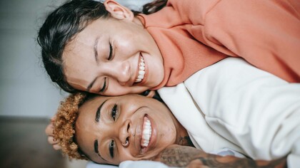 Two women making the choice to prioritize happiness 