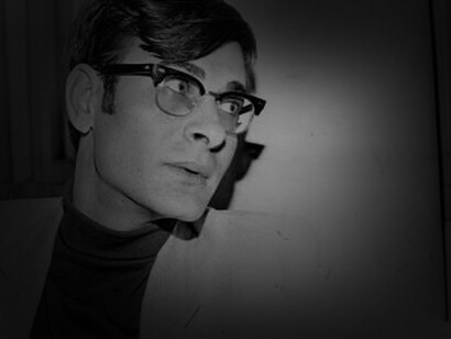 A young Mahmoud Darwish listening intently and perhaps pondering on his next poem