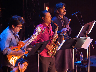 The Song of the Jasmine; Rajna Swaminathan (mridangam), Rez Abbasi (guitar), Rudresh Mahanthappa (saxophone) V. K. Raman (South Indian flute); Photo: Praba Manivasagar.