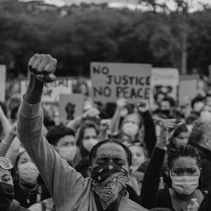 Man raising his fist during a protest for Black Lives Matter in Paris. Secular society today is making its ideas into a god