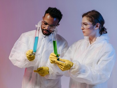 Researchers analyzing samples in a controlled laboratory environment, symbolizing the dedication required to advance biotechnology and human health