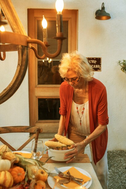 A woman setting the table 