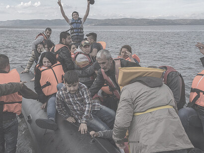 An inflatable boat with Syrian Refugees just arrived safely to Skala Sykamias, Lesvos island, Greece