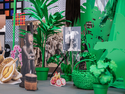 Stephanie Syjuco, detail of “Dodge and Burn (Visible Storage)” from “Stephanie Syjuco: Rogue States” at the Contemporary Art Museum in St. Louis, MO, 2019. Wooden platform, digital photos and printed vinyl on lasercut wood, chromakey fabric, printed backdrops, seamless paper, artificial plants, mixed media. Overall installation: 240 x 204 x 96 inches. Edition of 3 + 2AP. Courtesy of the artist and Catharine Clark Gallery, San Francisco