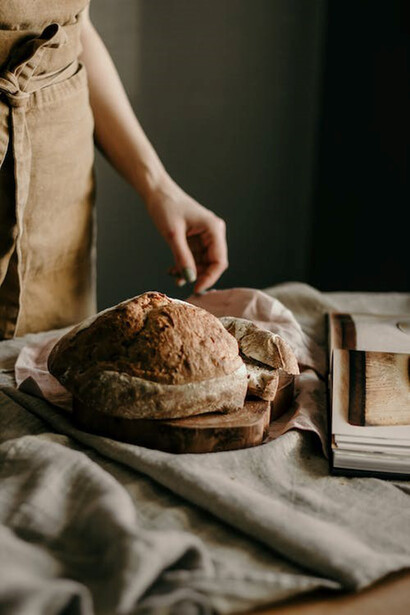 Female hands preparing sourdough bread in kitchen