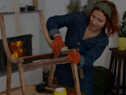 A skilled female designer transforms and creates unique furniture pieces, merging restoration with modern design innovation