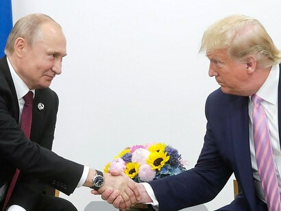 Russian President Vladimir Putin meets with U.S. President Donald Trump in 2019