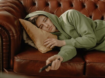A man sulking and is not enjoying the new year's eve festivities