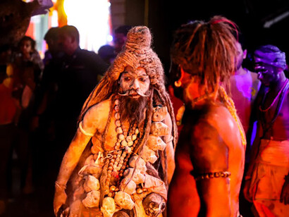 A man dressed in a costume performs the Shiva dance in front of a crowd in Jodhpur, India