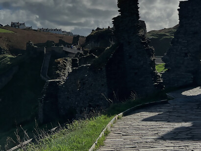 Tintagel Castle is a medieval fortification located on the peninsula of Tintagel Island adjacent to the village of Tintagel, North Cornwall in the United Kingdom