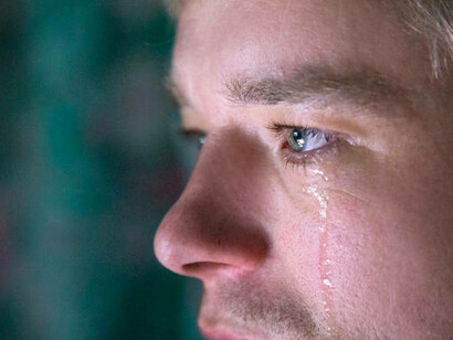 A man crying, freely showing his emotions. The fear of being seen as weak or not ‘manly enough’ is real