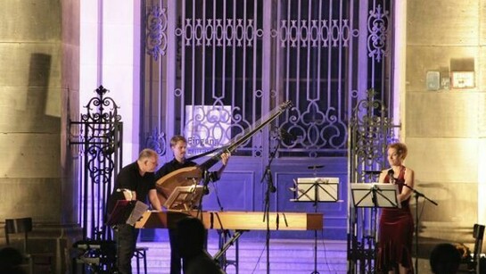 Open-air concert at the Bode Museum in Berlin centre after sunset.