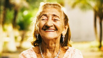 Elderly woman smiling with joy