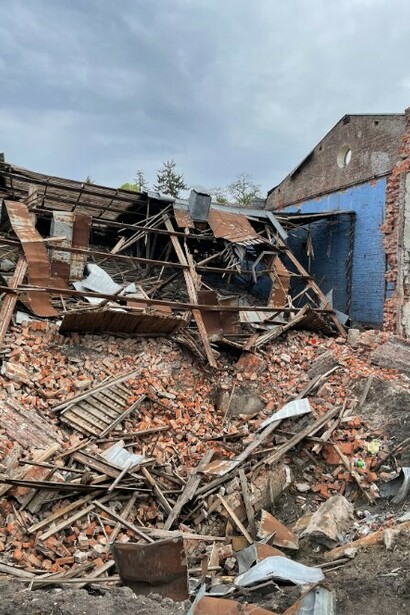 A pile of rubble lies beside the remains of the cinema and youth center in Chernihiv, Ukraine, which was destroyed by an aerial bomb in March 2022