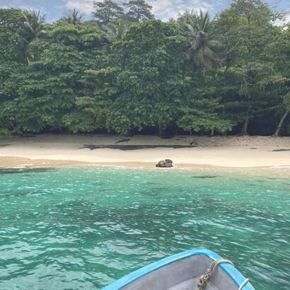 A boat on body of water beside island, São Tomé and Príncipe