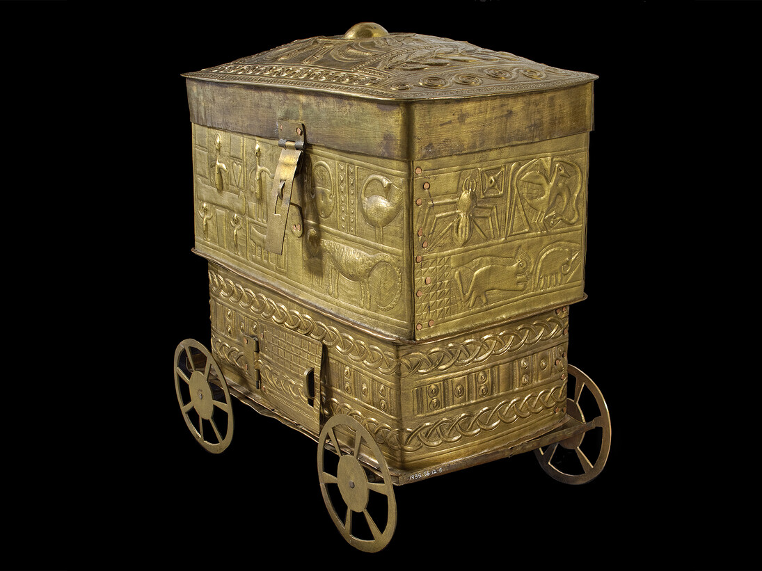 Decorated sheet-brass box, often used to carry shea butter or gold, richly decorated with symbolic designs such as a Sankofa bird, Ananse the spider and two crocodiles with one stomach. Collected c. 1900, Ghana. On display in West Africa: Word, Symbol, Song and courtesy of the Pitt Rivers Museum, University of Oxford