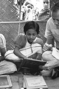 Jim Grant teaches two young girls