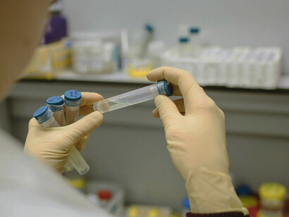 A focused female scientist conducting an experiment in the laboratory