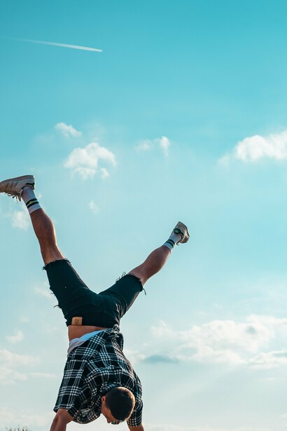 Man doing a cart wheel in excitement