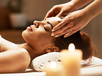 A woman enjoys a soothing Ayurveda massage, as herbal oils work to detoxify and rejuvenate her body, promoting a sense of deep relaxation and balance 