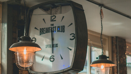 A large clock with the word ''Breakfast'' on it 