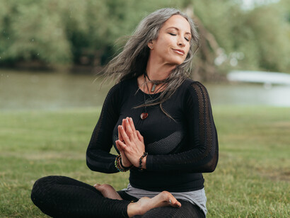 A woman thinks deeply while spending time in nature