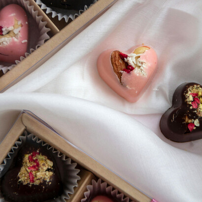 Detailed view of a chocolate gift box filled with heart-shaped treats, capturing the essence of romance and indulgence
