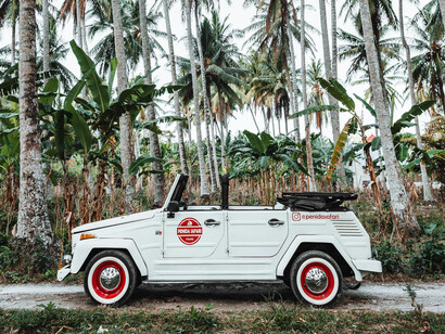 A small utility vehicle stopped in route to a remote beach