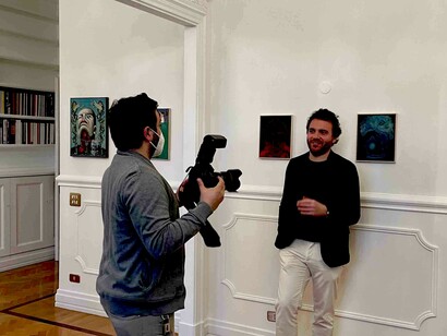 Andrea Festa being photographed in his apartment