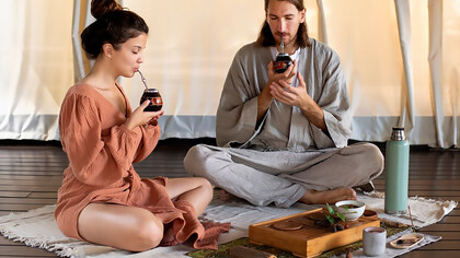 People embracing yerba mate tea as a spiritual practice, guided by online gurus and virtual healing