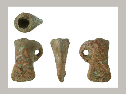 Late Bronze age or Roman (1150 BCE - 400 CE) miniature axhead, Wiltshire