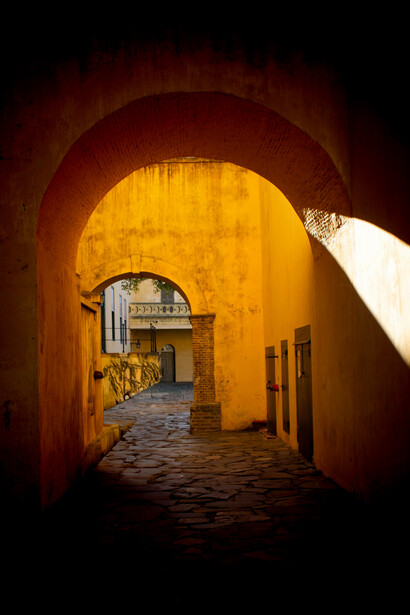 Historic archway along a narrow street in the medina of Marrakesh, Marrakesh–Safi, Morocco