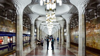Ornate ceiling and chandeliers at Mustakillik Maydoni Metro Station, Tashkent, Uzbekistan