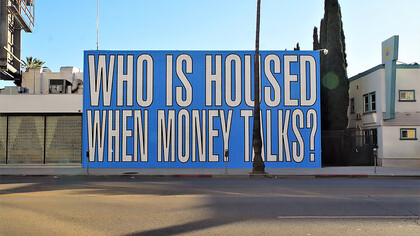 Barbara Kruger’s mural on the housing crisis poses a striking question—‘Who is housed when money talks?’—highlighting inequality in access to shelter