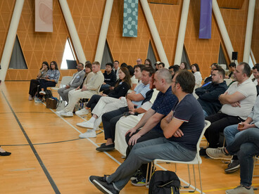 Participants from different backgrounds gathered at an indoor civil society meeting to discuss community issues