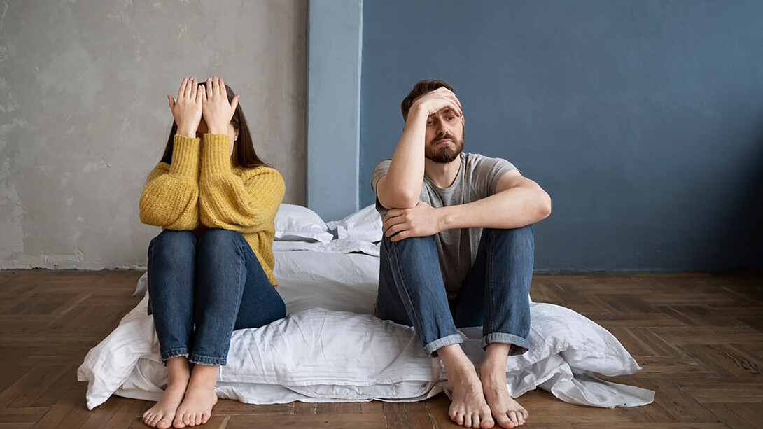 A couple experiencing communication difficulties, sitting on the floor