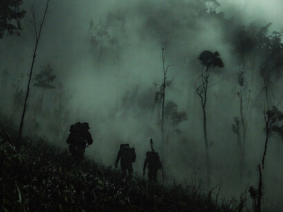 Just as Ramparts exposed, the reality of the war was often obscure. Soldiers moved through the dense, disorienting fog of the Vietnam jungle, mirroring the hidden nature of corporate involvement