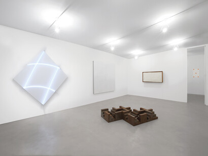 (From left to right) François Morellet, Cruibes n°16, 2013, Neon and white acrylic on canvas on wood, 212x212 cm. Riccardo De Marchi, Untitled, 2015 Aluminum, paint and holes, 200x200 cm. Gianni Colombo, Structuring beating, 1959 Polystyrene foam, foam rubber, wood, electromechanical animation, 78x140 cm. Niele Toroni, Brush marks n. 50 at intervals of 30 cm, 2015 Paper. Nicola Carrino, Constructive 1/69 C, 1975. Dynamic path 4.4, 2016 Iron, 16 scalar forms 30x30x30 cm each. Partial view of the exhibition A arte Invernizzi. Courtesy A arte Invernizzi, Milan. Photo by Bruno Bani