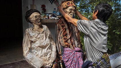 The Ma'nene Ritual is a traditional ceremony in Tana Toraja where the bodies of ancestral family members are exhumed, carefully cleaned, and dressed in new clothes as a way to honor and show respect for the deceased